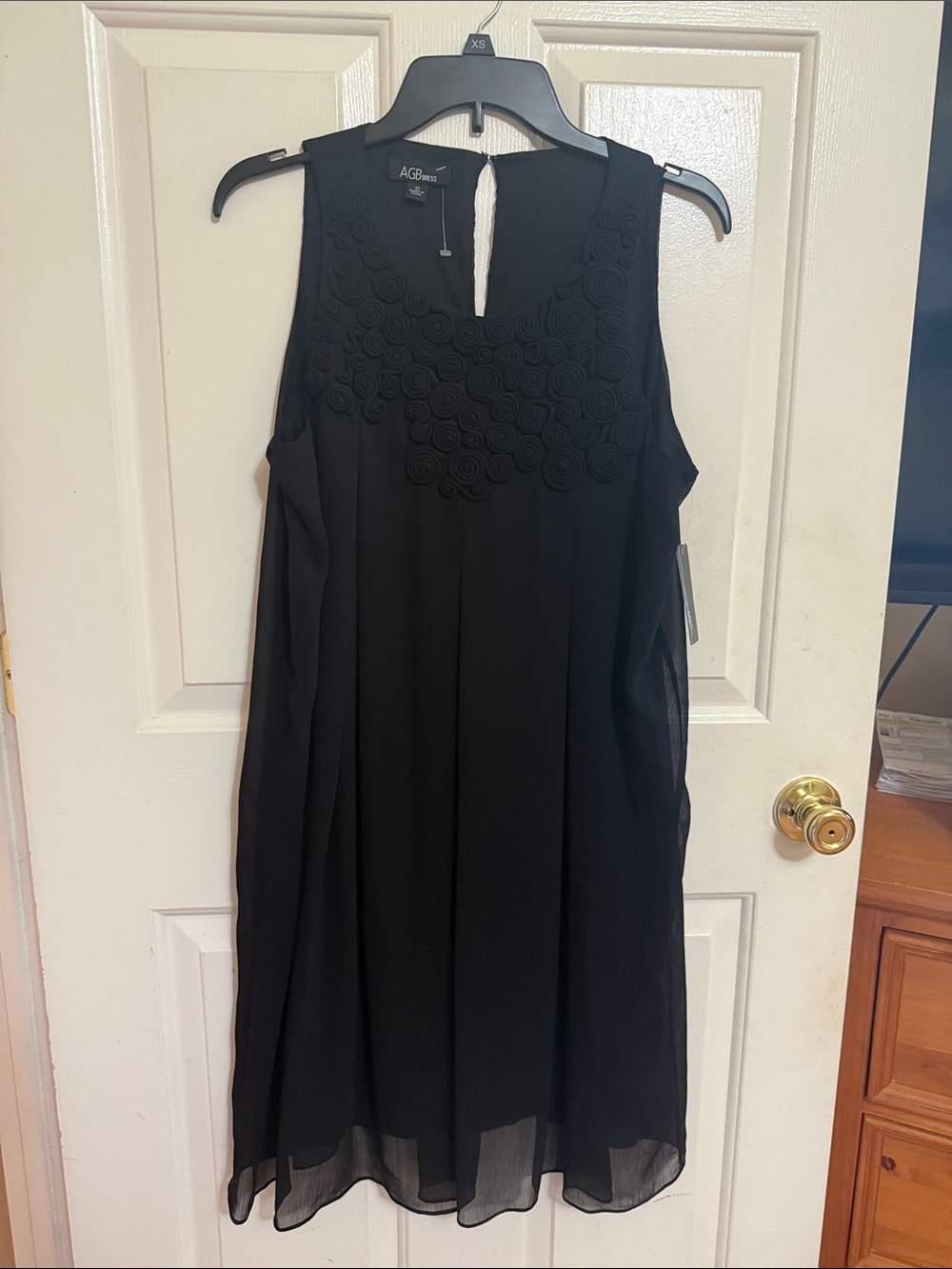 AGB Black Sleeveless Rosette Neckline Dress